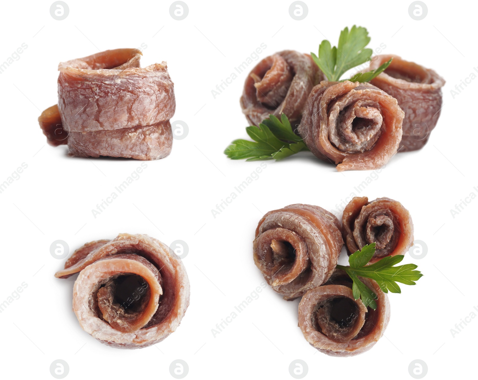 Image of Set with delicious rolled anchovy fillets on white background