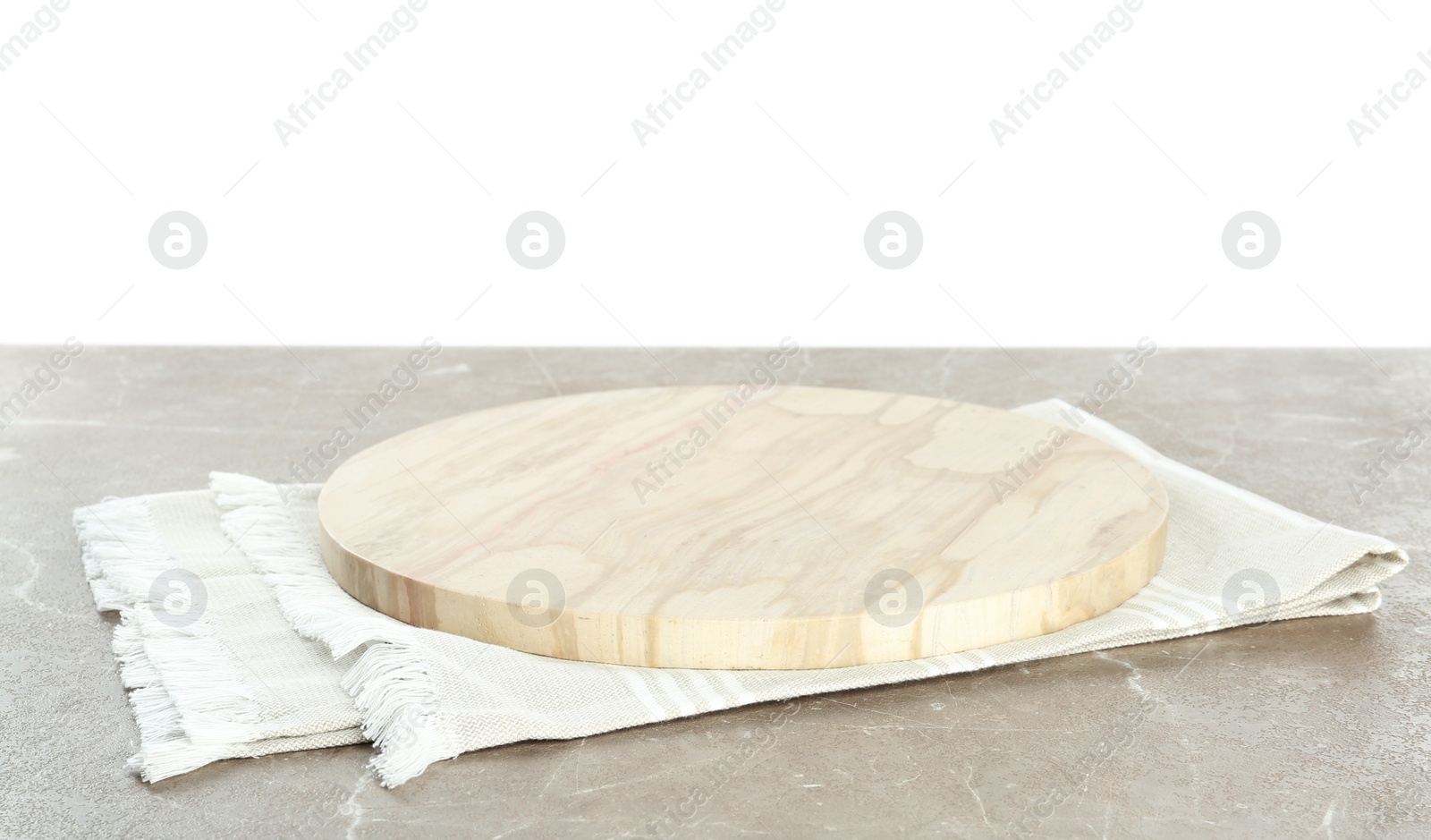 Photo of Empty wooden plate and napkin on marble table