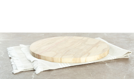 Photo of Empty wooden plate and napkin on marble table