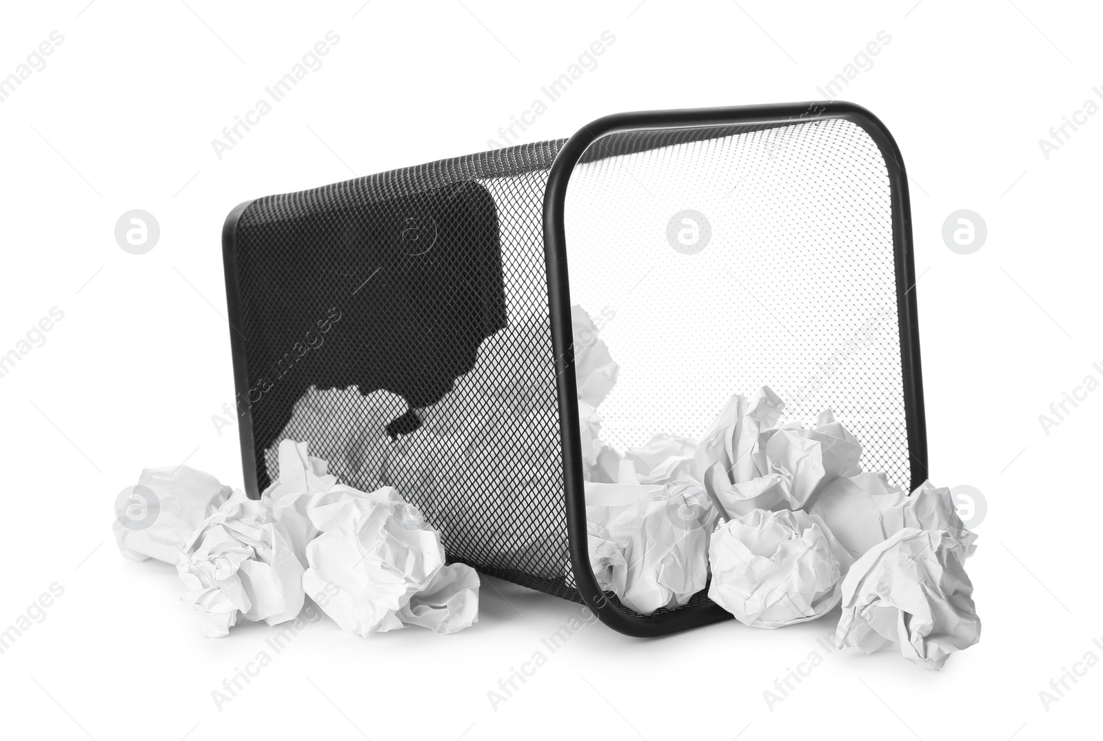 Photo of Basket with scattered crumpled paper balls on white background