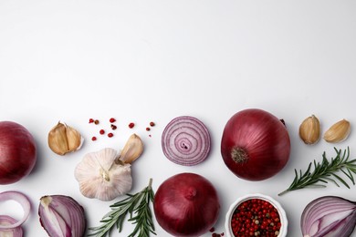 Photo of Fresh red onions, garlic, rosemary and spices on white background, flat lay. Space for text