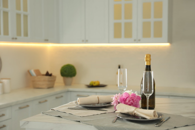 Beautiful table setting in modern kitchen. Interior design