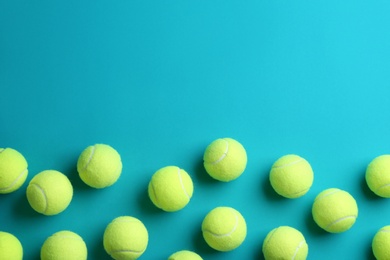 Photo of Tennis balls on blue background, flat lay. Space for text