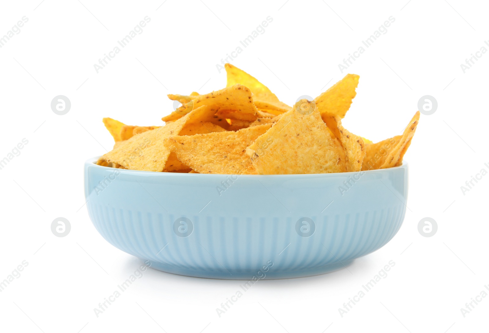 Photo of Ceramic bowl of Mexican nachos chips on white background