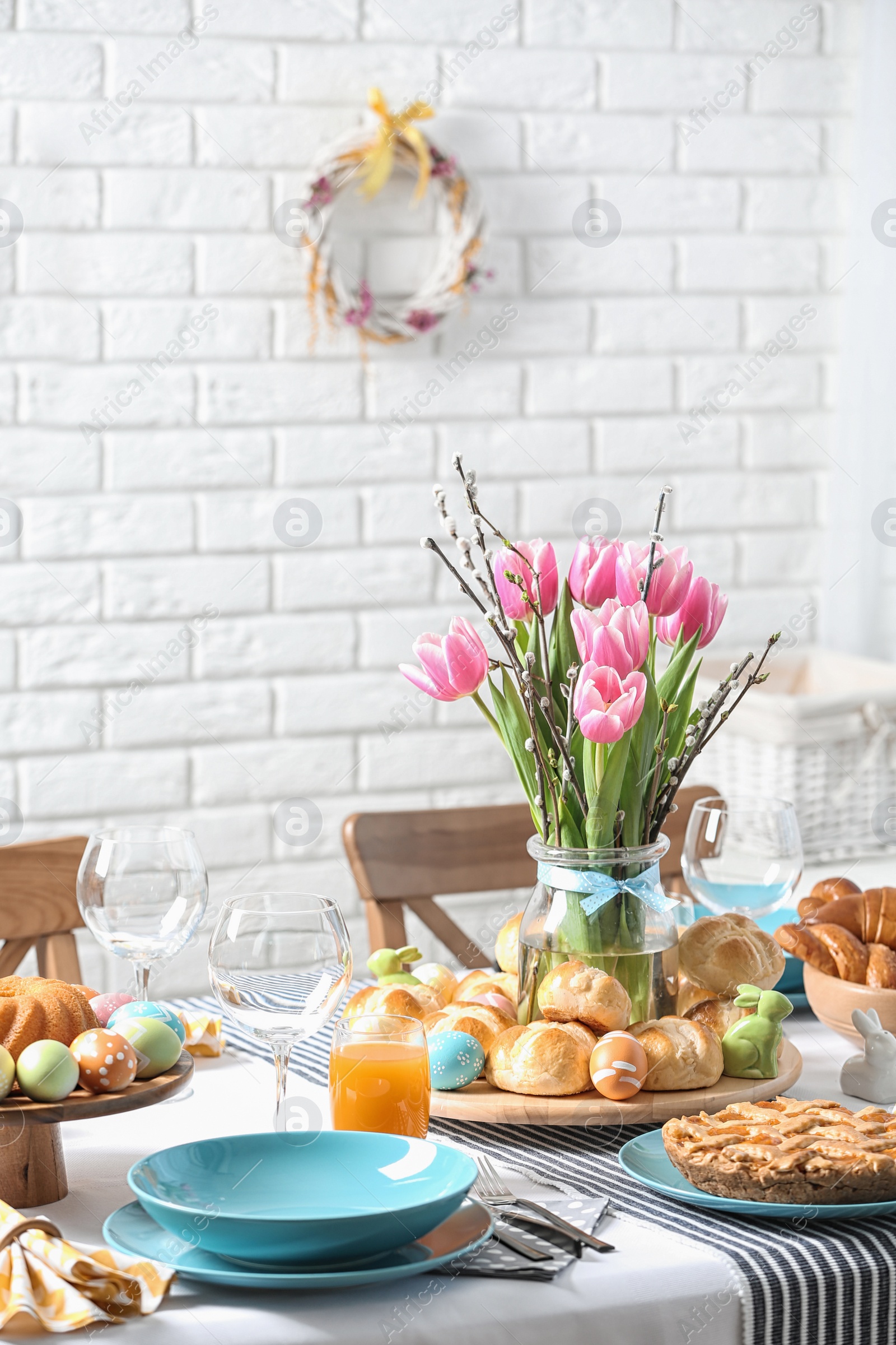 Photo of Festive Easter table setting with traditional meal at home
