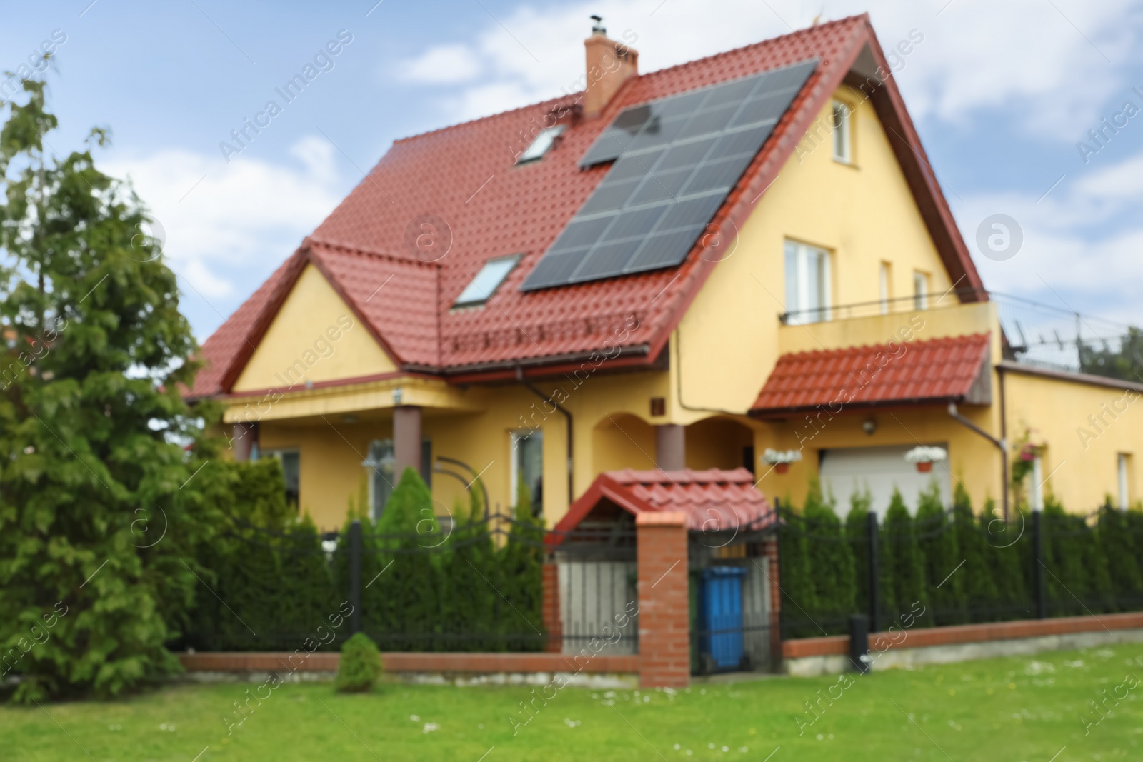 Photo of Blurred view of beautiful house with garden