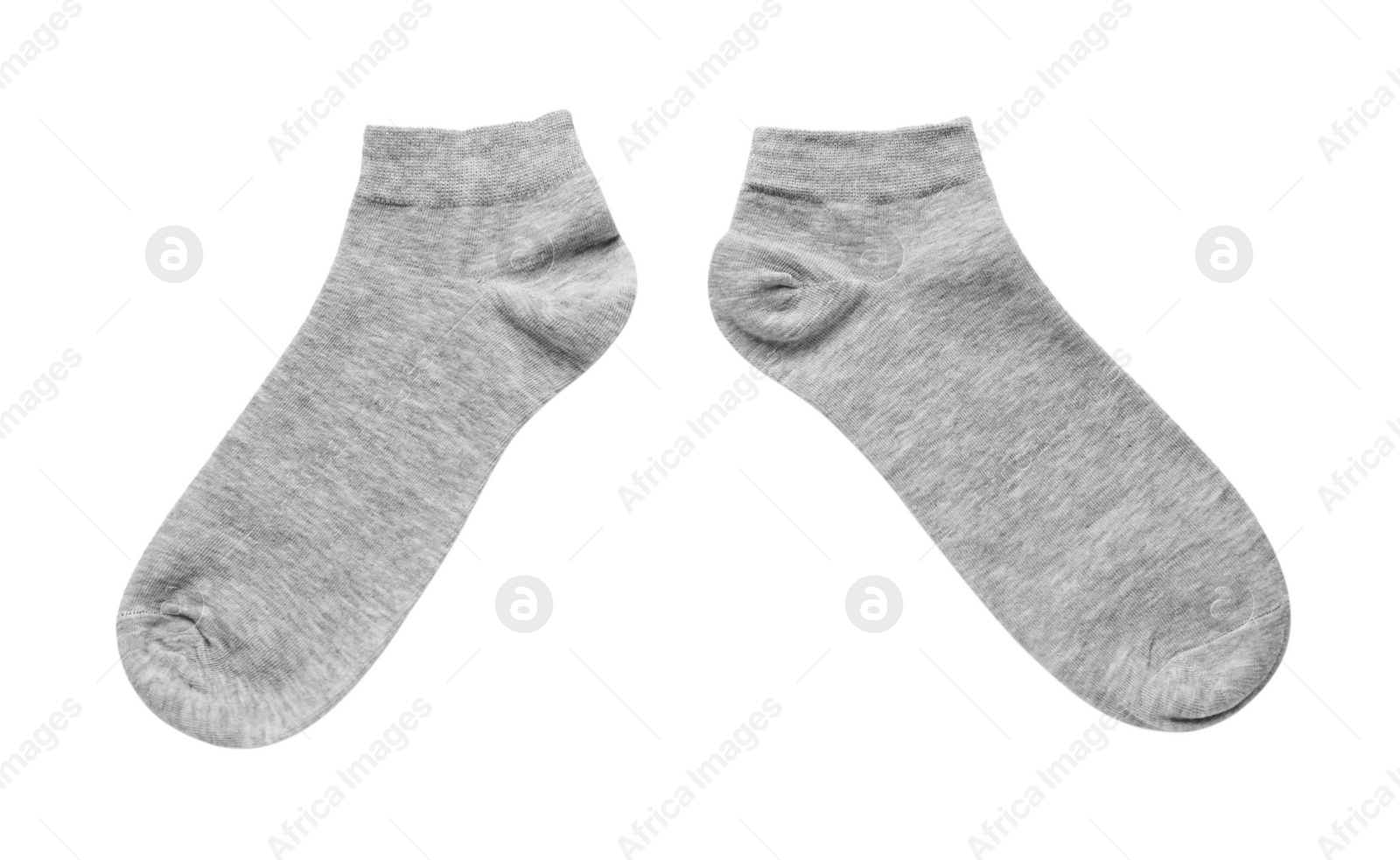 Photo of Pair of grey socks on white background, top view