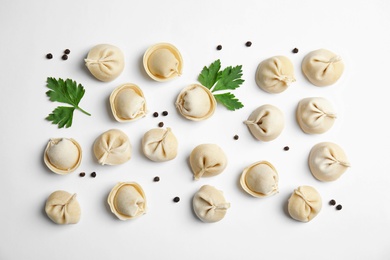 Photo of Composition with raw dumplings on white background, top view. Home cooking