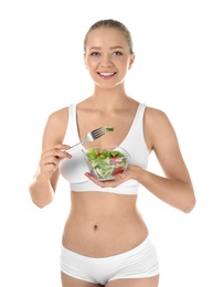 Young woman with salad on white background. Healthy diet