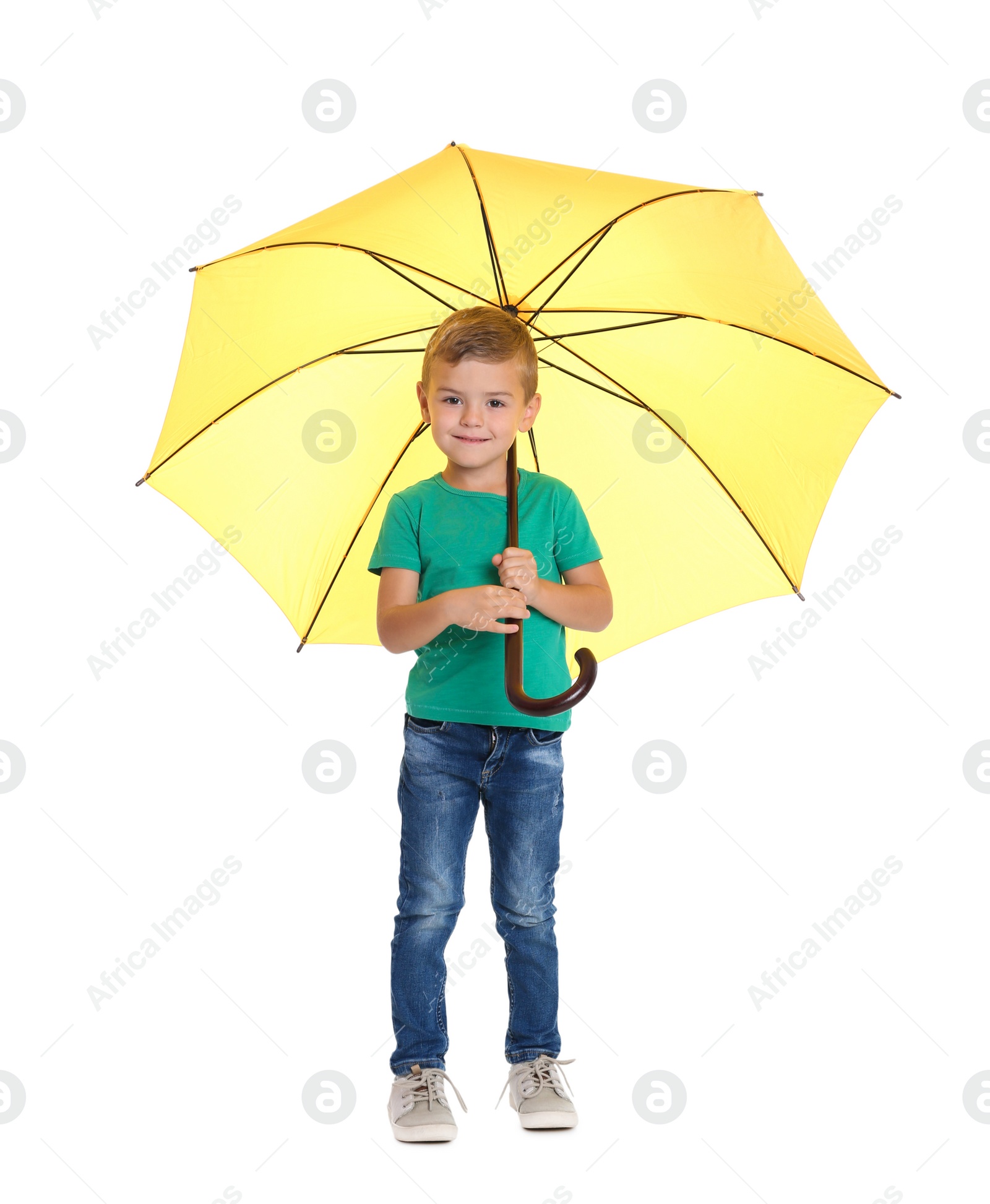 Photo of Little boy with yellow umbrella on white background