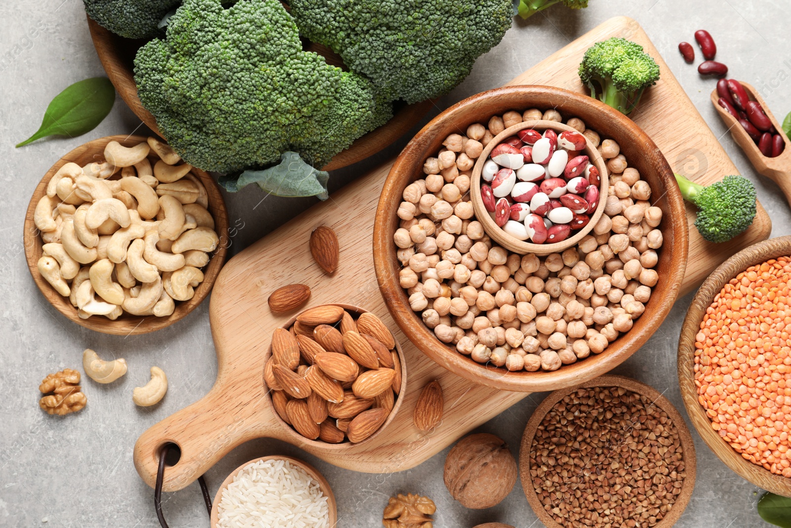 Photo of Set of natural food high in protein on grey background, top view