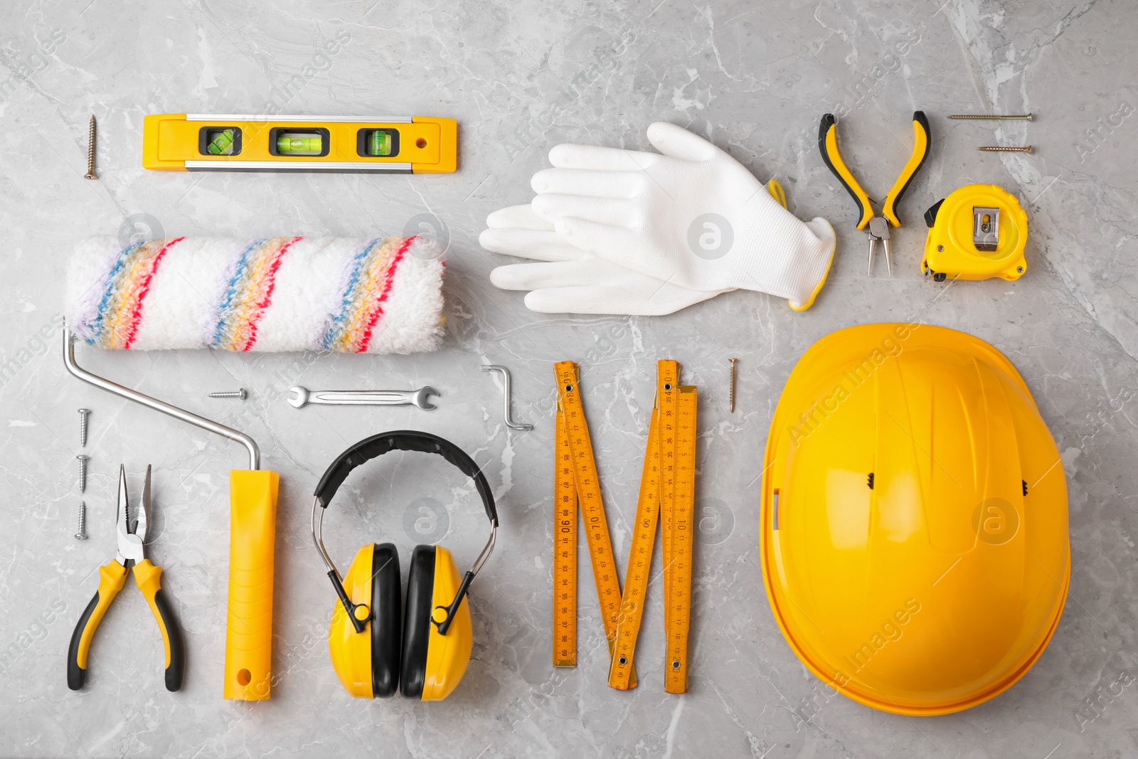 Photo of Flat lay composition with different construction tools on marble background