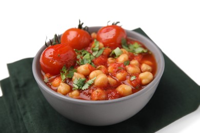 Photo of Delicious chickpea curry in bowl and dark cloth on white background, closeup