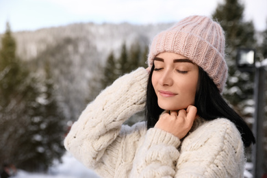 Photo of Portrait of beautiful young woman on winter day