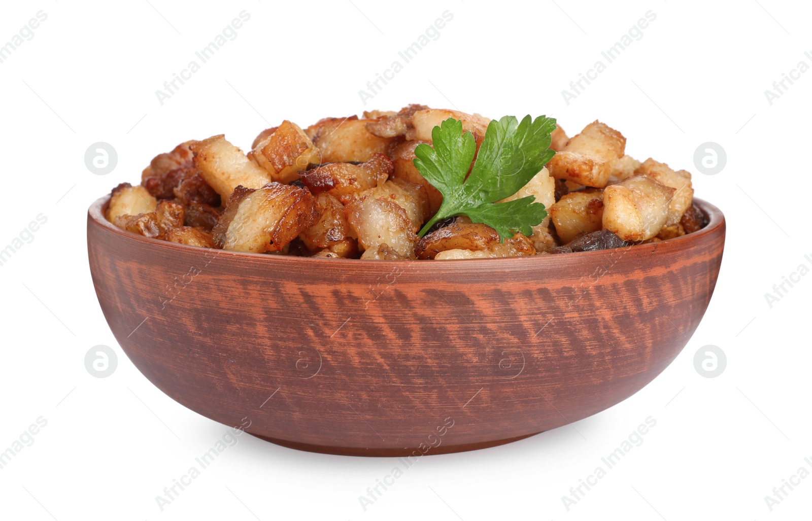 Photo of Tasty fried cracklings with parsley in bowl on white background. Cooked pork lard