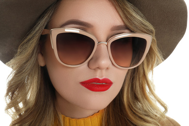 Photo of Young woman wearing stylish sunglasses and hat on white background