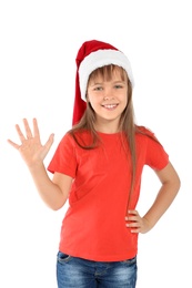 Cute little child in Santa hat on white background. Christmas celebration