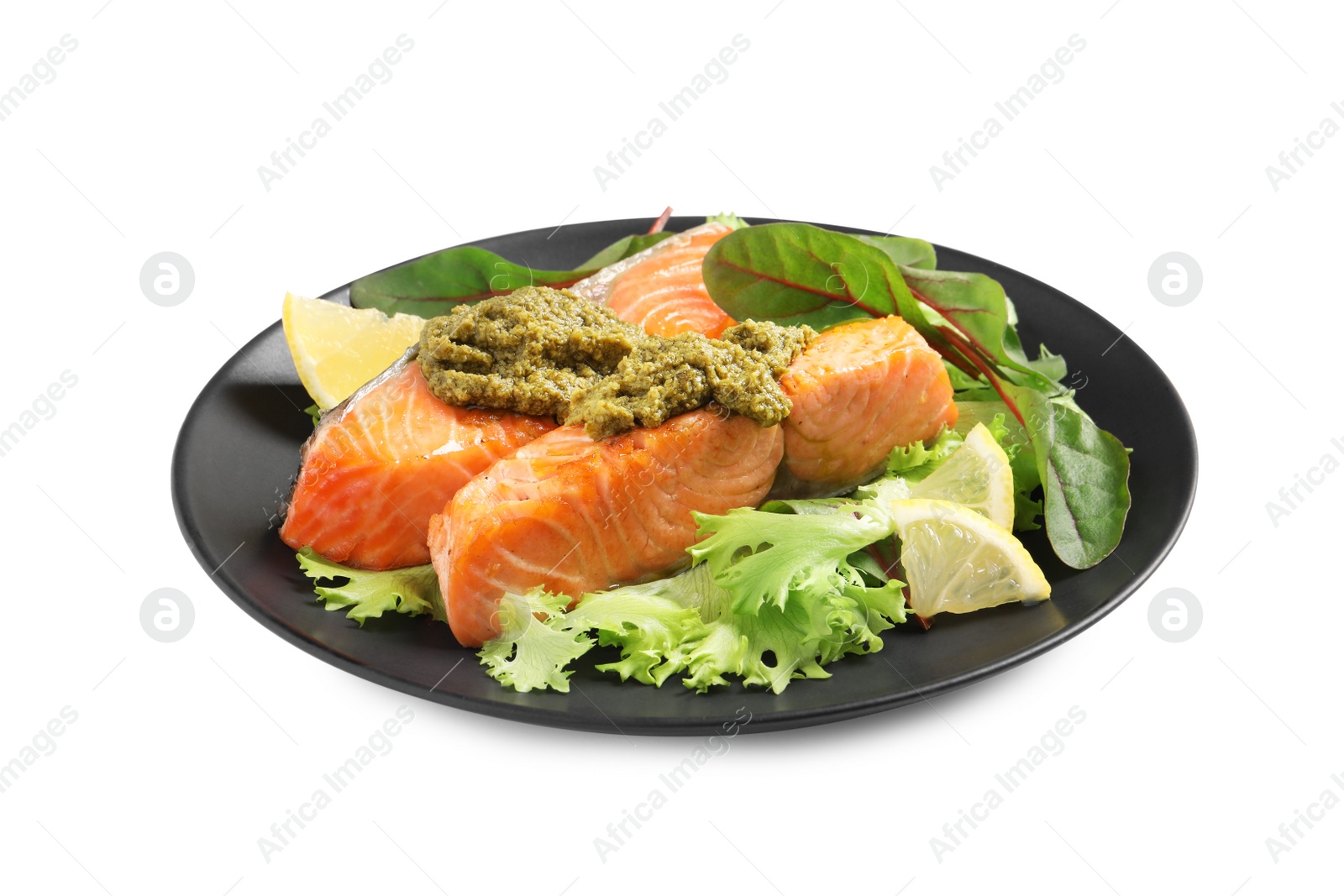 Photo of Tasty cooked salmon with pesto sauce on white background