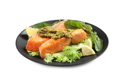 Tasty cooked salmon with pesto sauce on white background