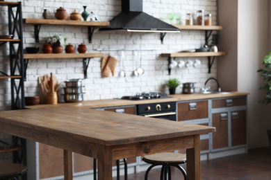 Empty wooden table in beautiful kitchen. Interior design