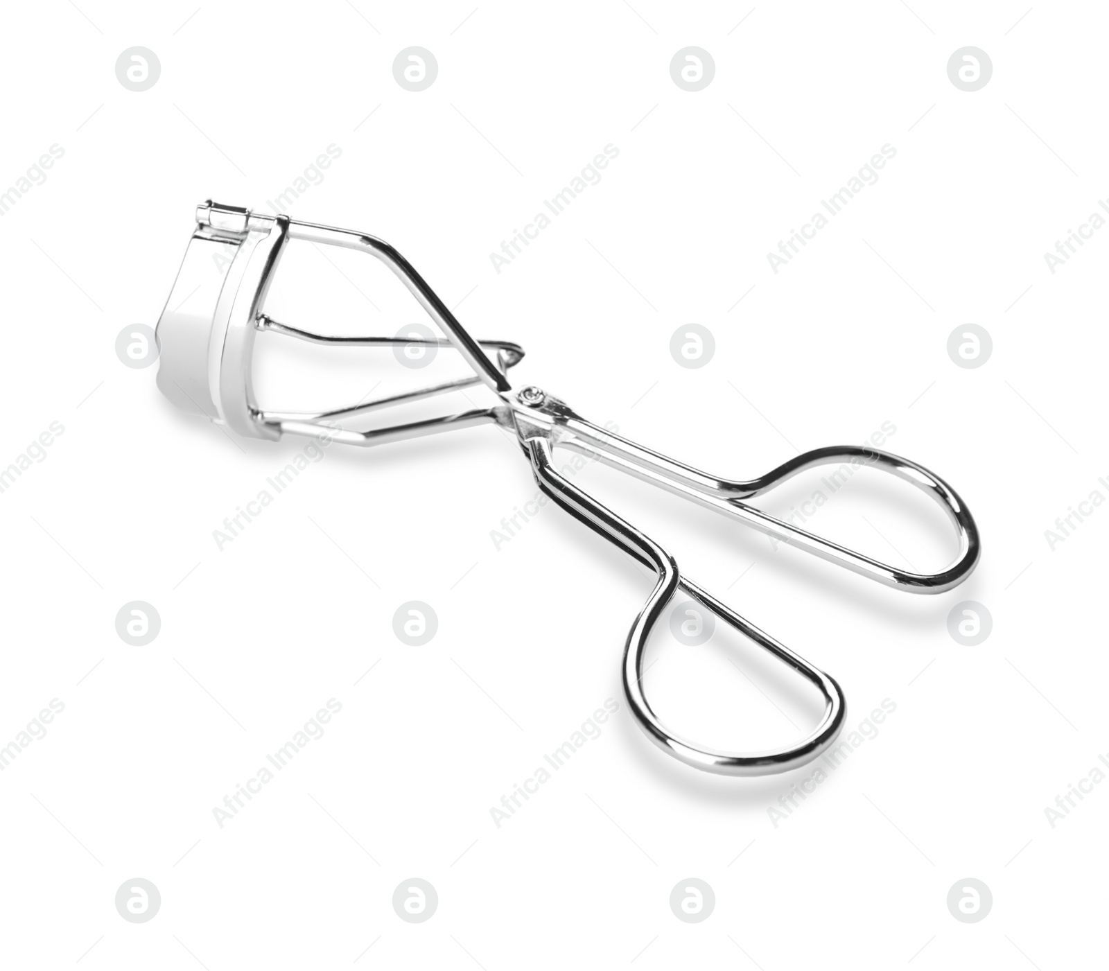 Photo of Eyelash curler isolated on white. Makeup tool