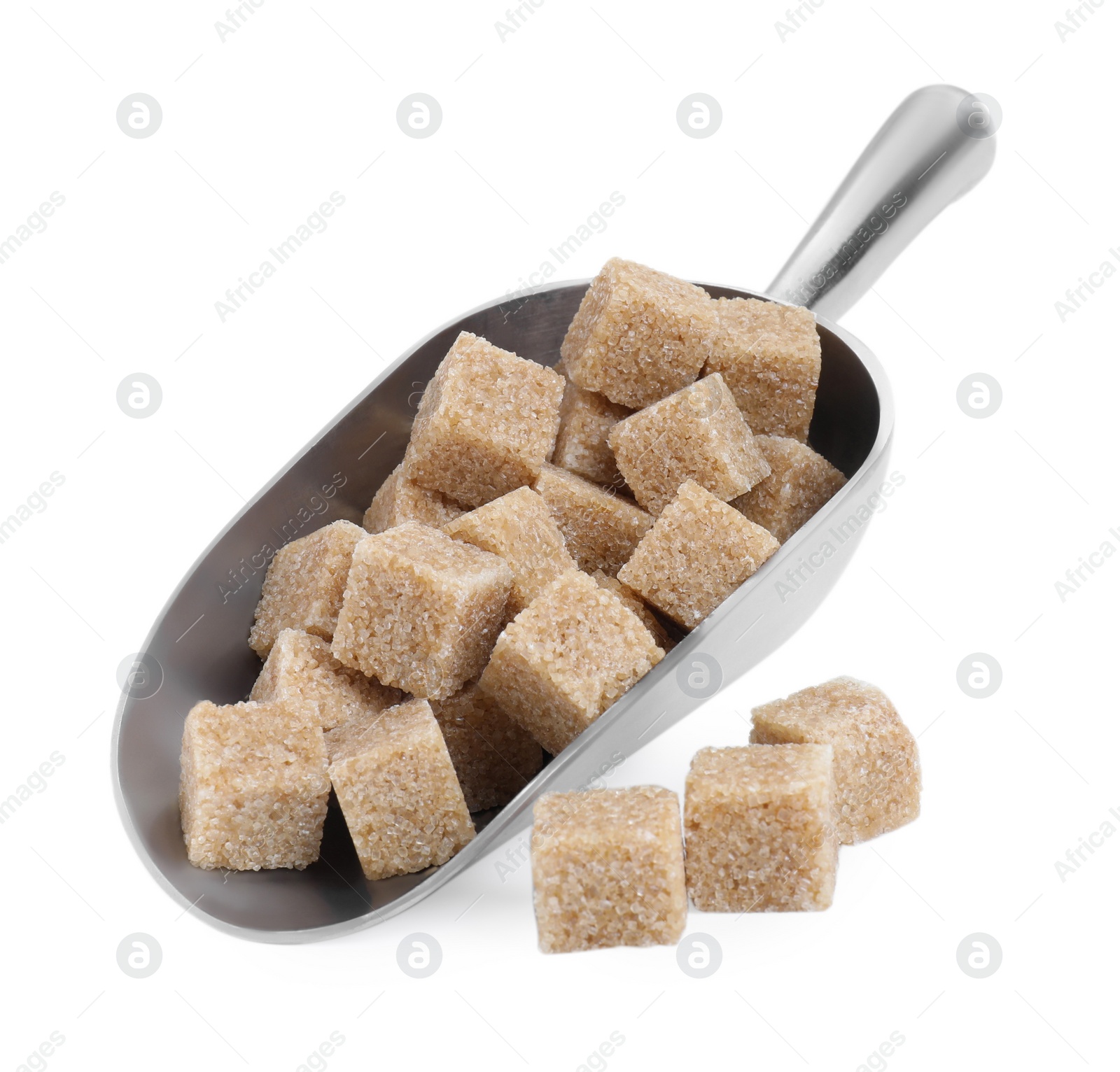 Photo of Brown sugar cubes in metal scoop isolated on white