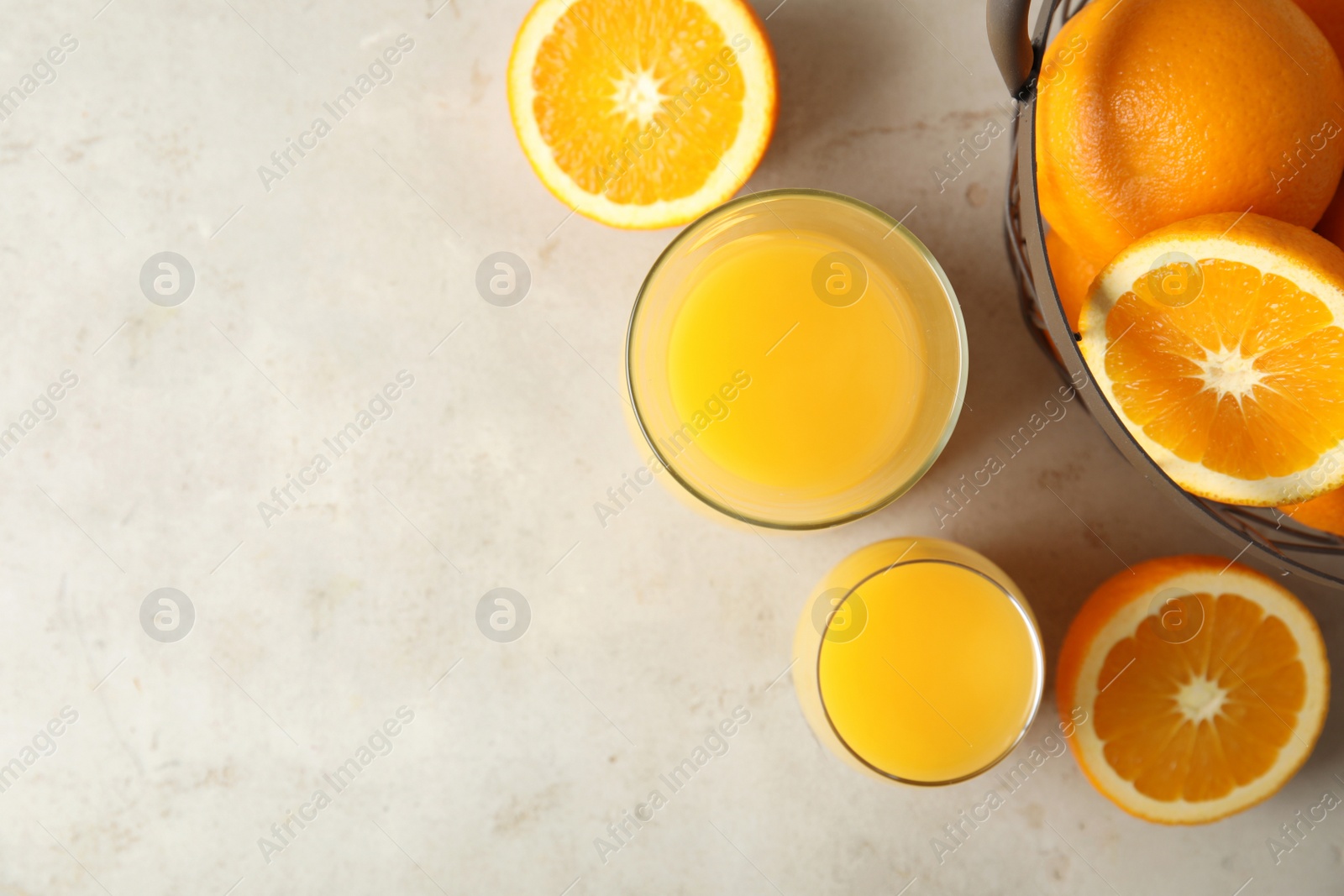 Photo of Flat lay composition with orange juice, fresh fruit and space for text on color background