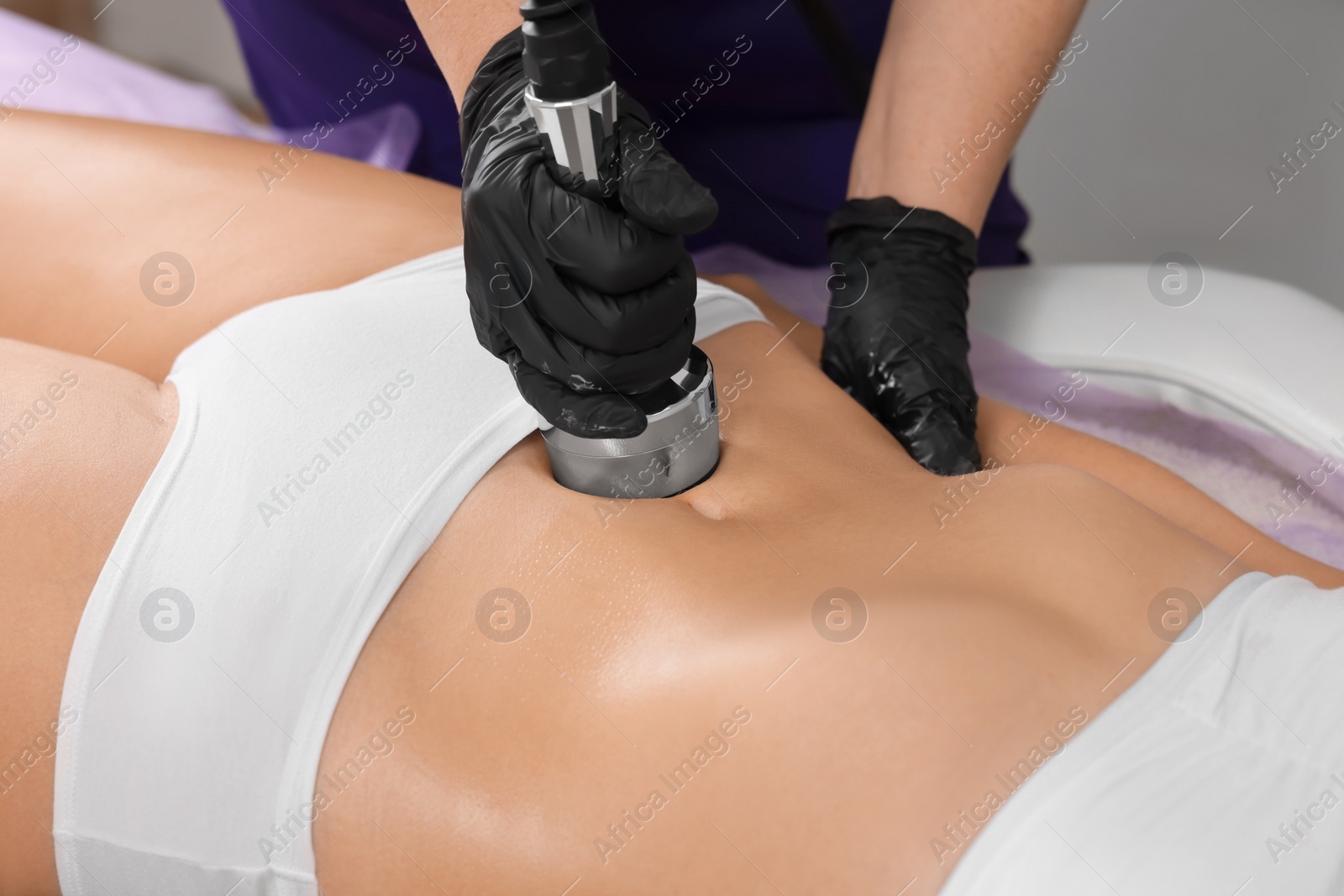 Photo of Woman undergoing radio frequency lifting procedure in beauty salon, closeup