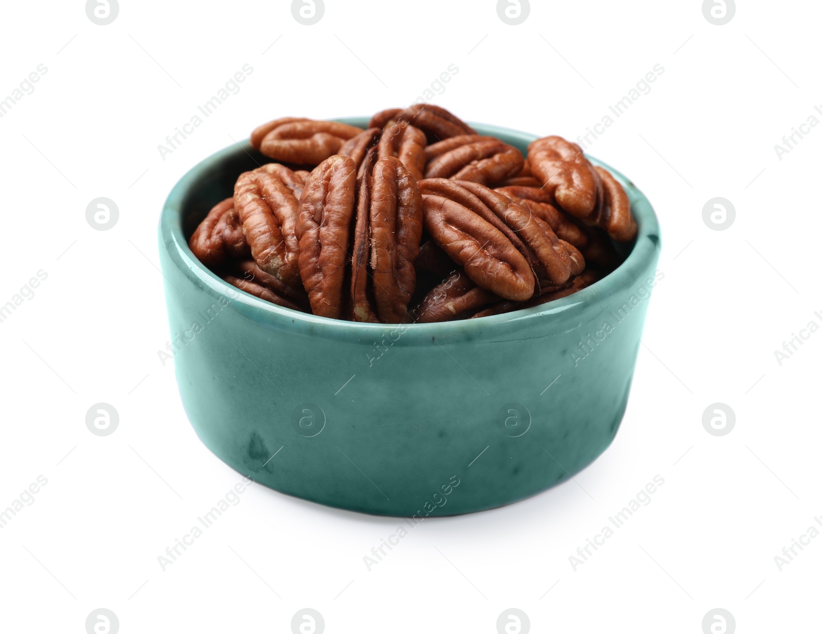 Photo of Tasty pecan nuts in bowl isolated on white