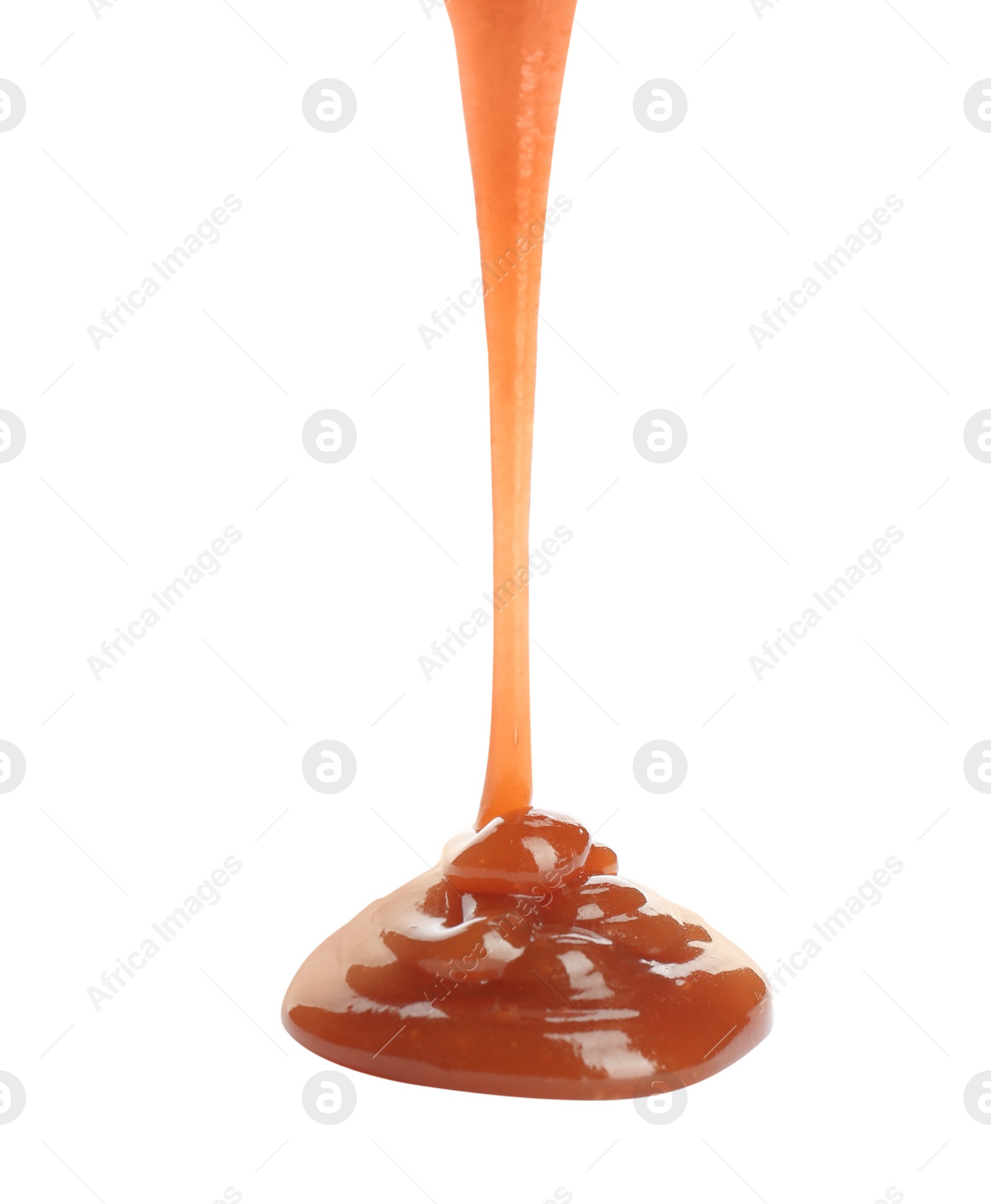 Photo of Pouring sweet caramel sauce on white background