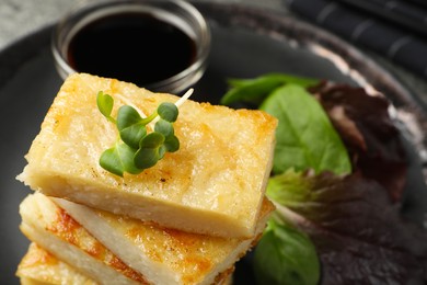Photo of Delicious turnip cake with herbs on table, closeup