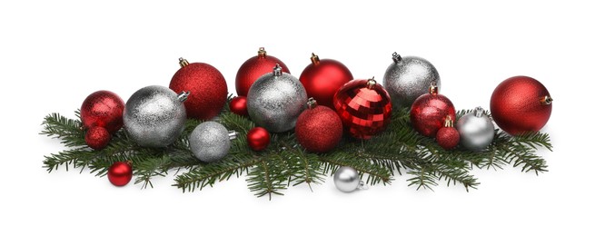 Photo of Beautiful Christmas balls and fir twigs isolated on white