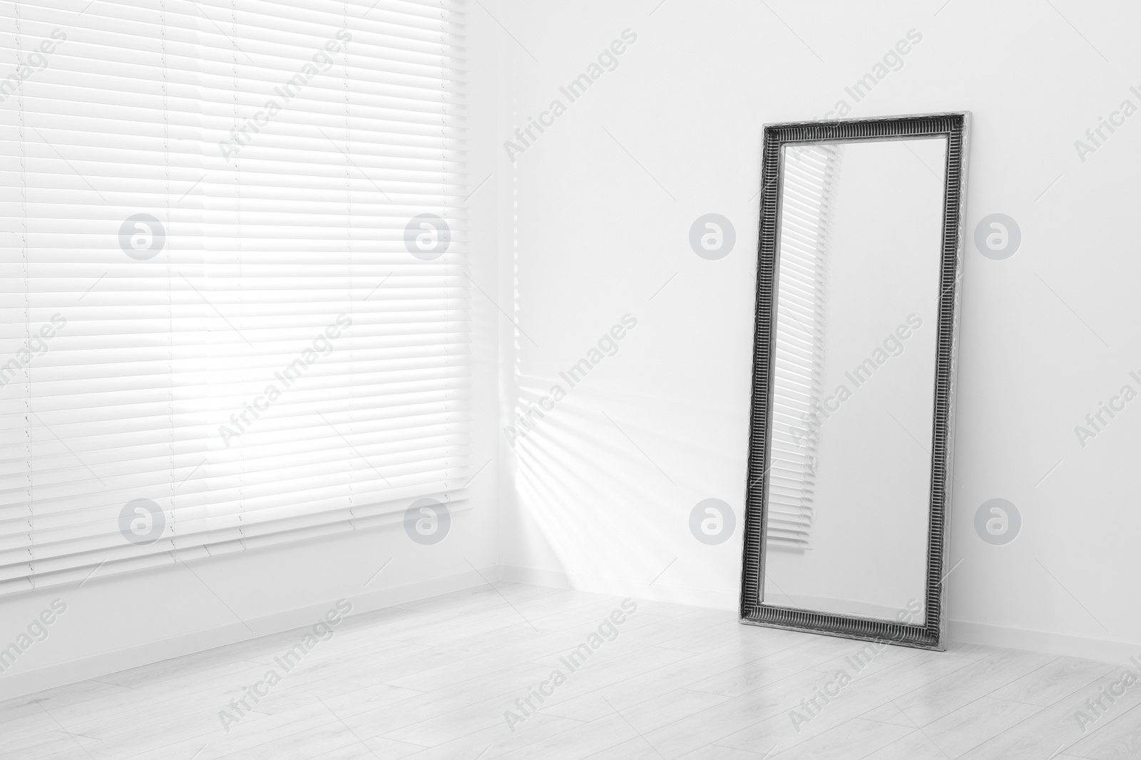 Photo of Stylish long mirror in makeup room. Space for text