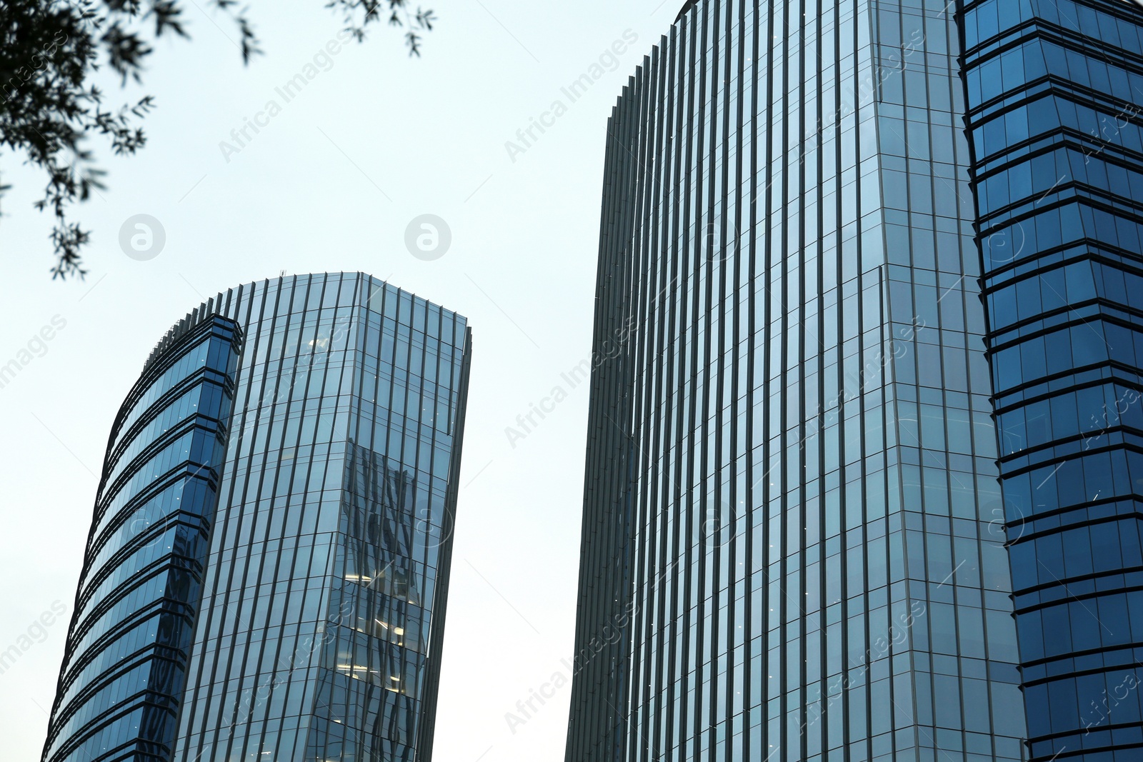 Photo of Low angle view of modern buildings with many windows against clear sky