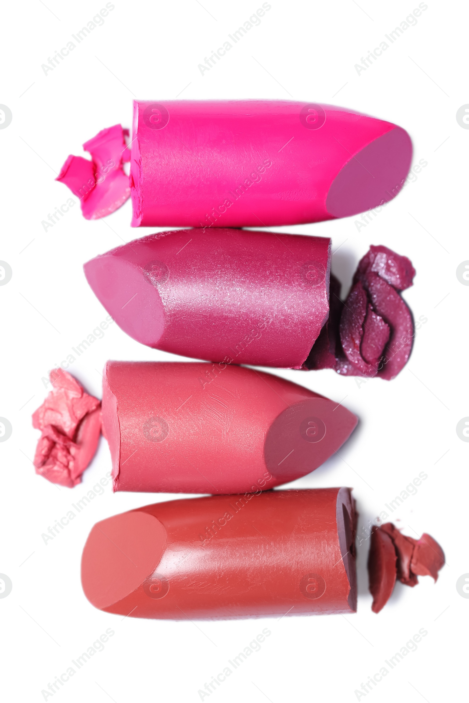 Photo of Many different bright lipsticks on white background, top view