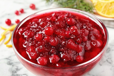 Photo of Delicious cranberry sauce in bowl, closeup view