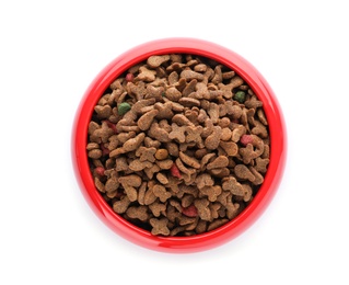 Bowl of dry pet food on white background, top view