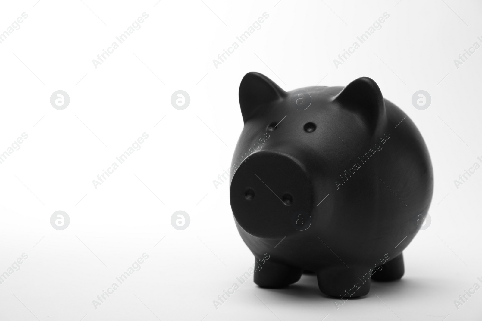 Photo of Black piggy bank on white background. Money saving