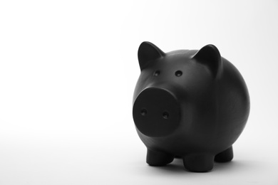 Photo of Black piggy bank on white background. Money saving