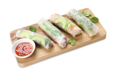 Delicious spring rolls and sauce isolated on white