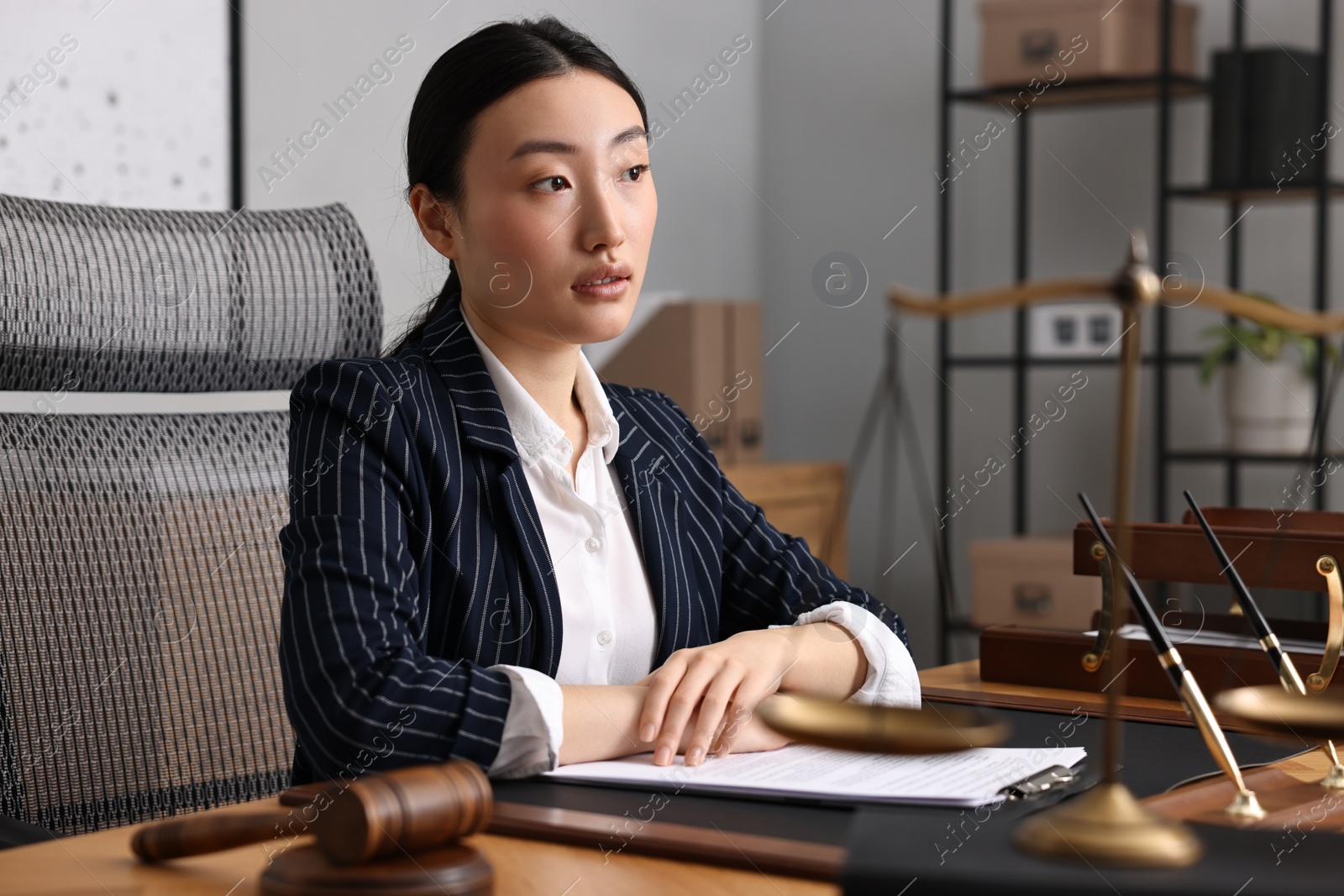 Photo of Portrait of notary at table in office