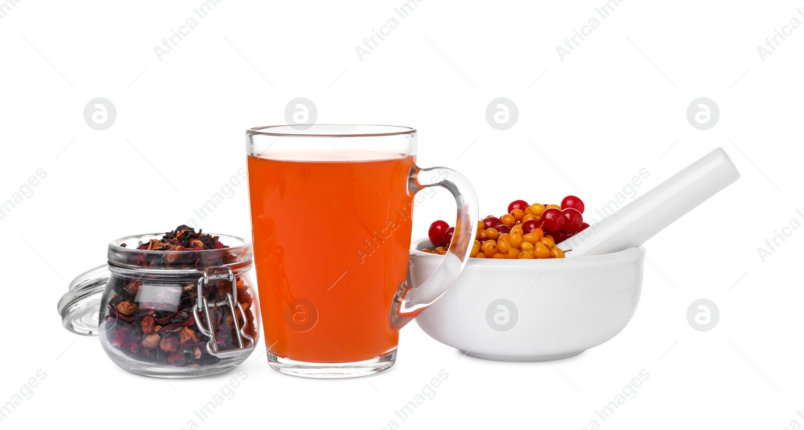 Photo of Glass cup of immunity boosting tea and ingredients on white background