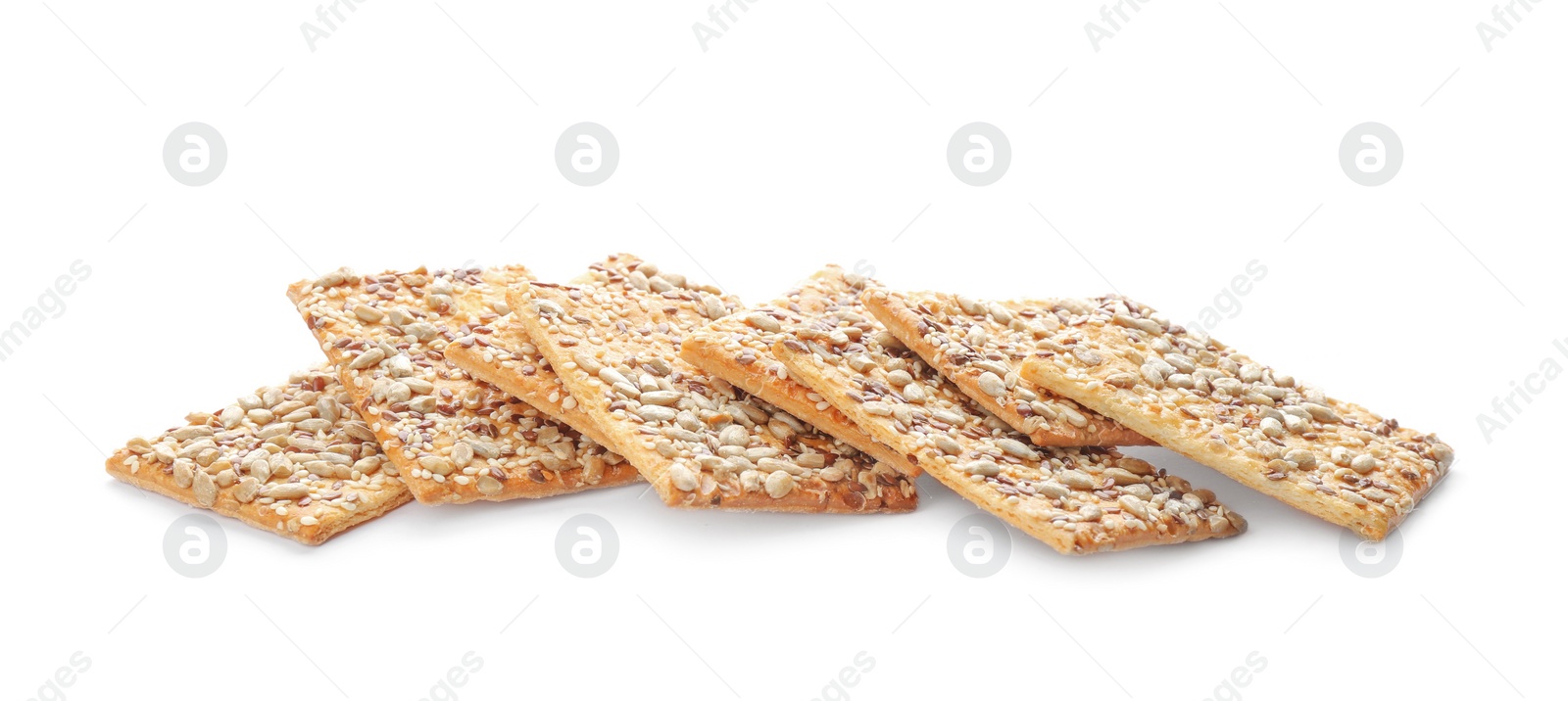 Photo of Delicious crispy crackers with different seeds isolated on white