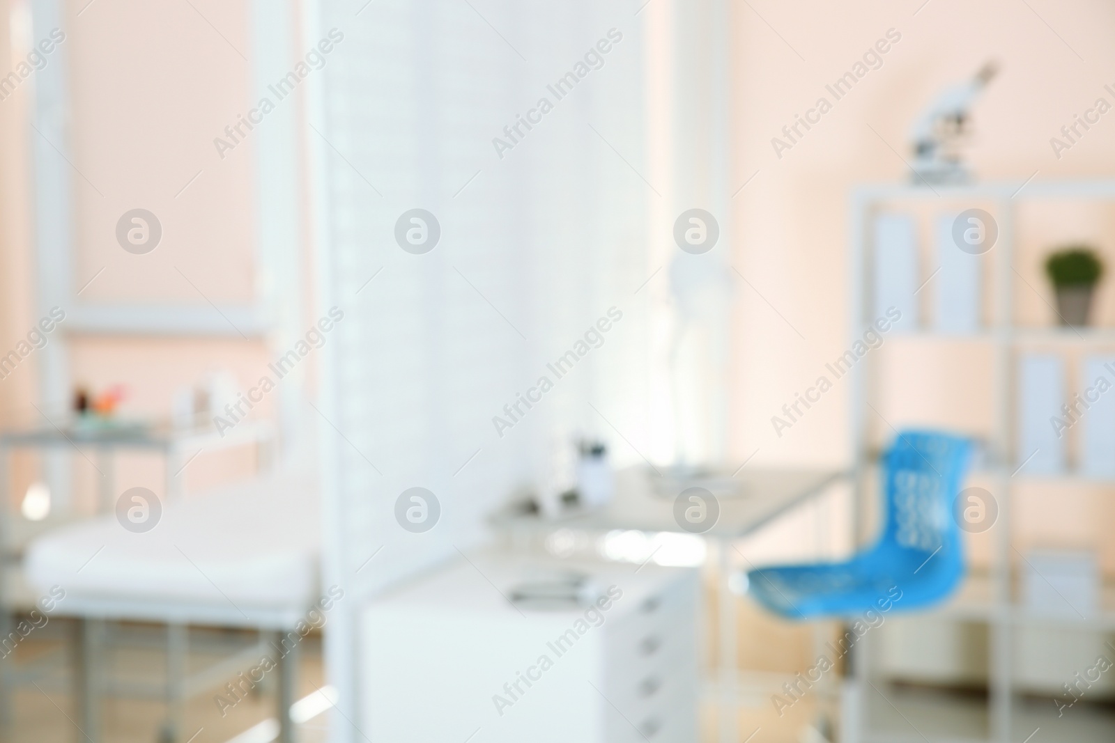 Photo of Blurred view of doctor's office interior with workplace