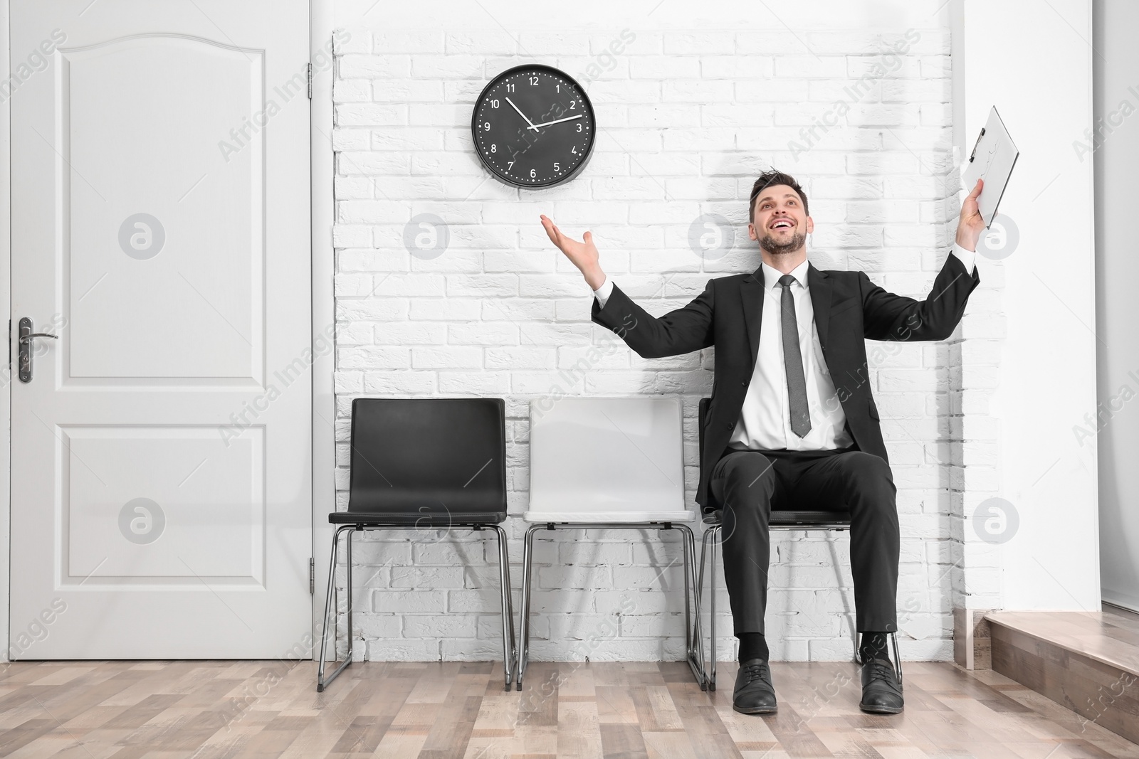 Photo of Young man waiting for job interview, indoors