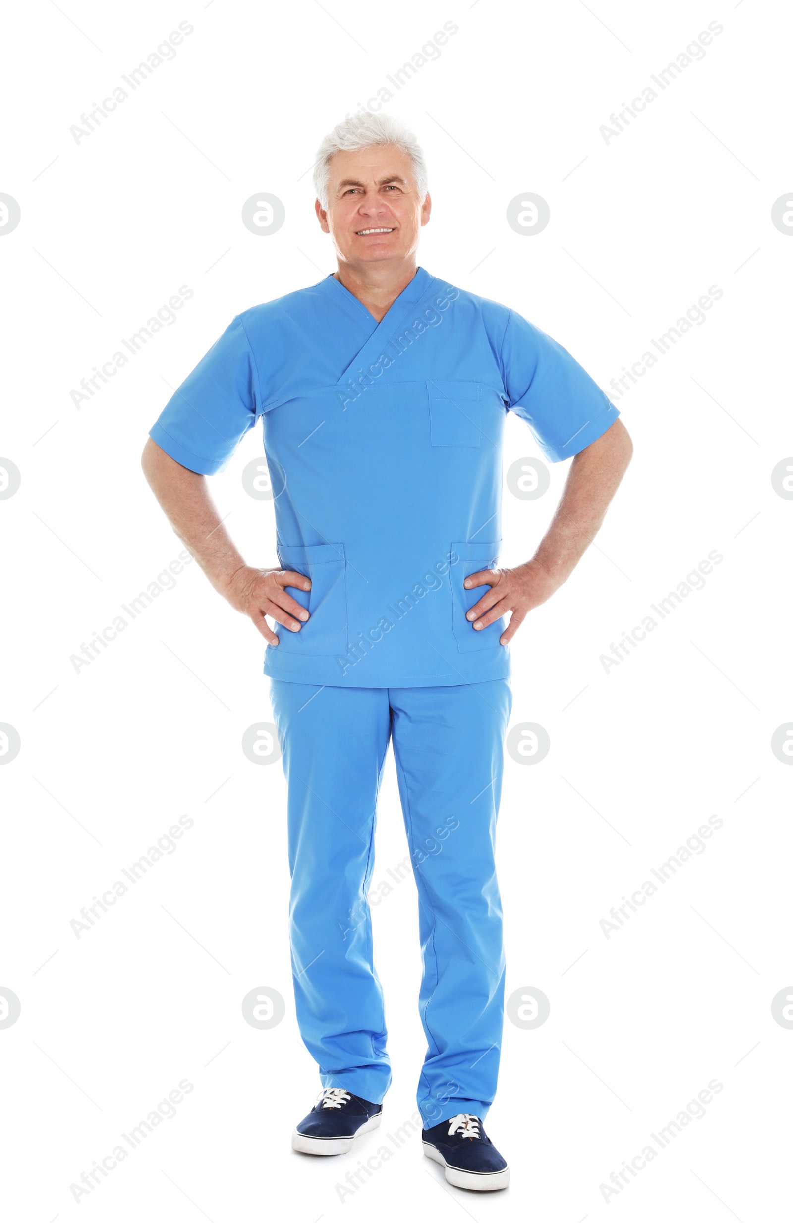 Photo of Full length portrait of male doctor in scrubs isolated on white. Medical staff