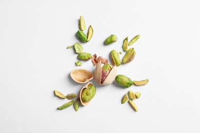Photo of Composition with organic pistachio nuts on white background