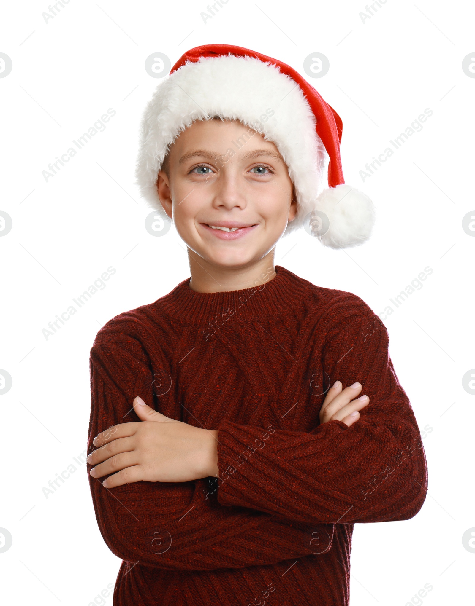 Photo of Happy little child in Santa hat on white background. Christmas celebration