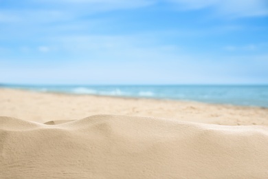 Beautiful beach with golden sand near sea, closeup view
