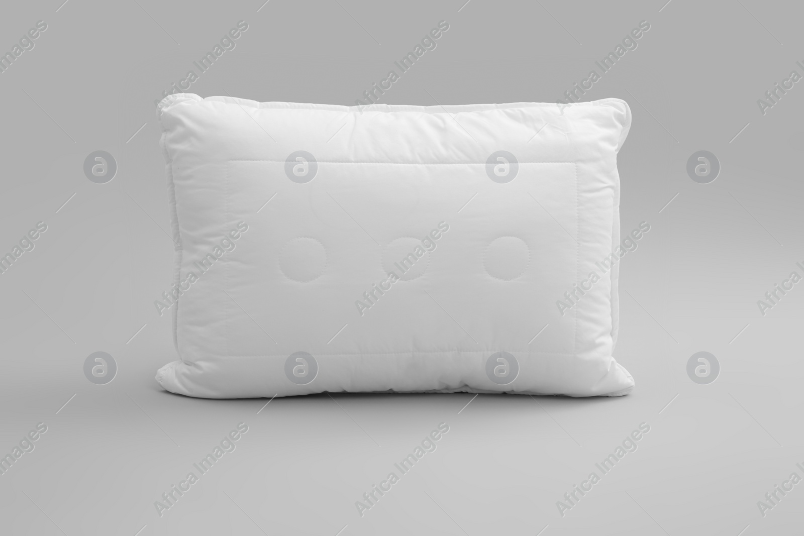 Photo of Clean soft bed pillow on grey background